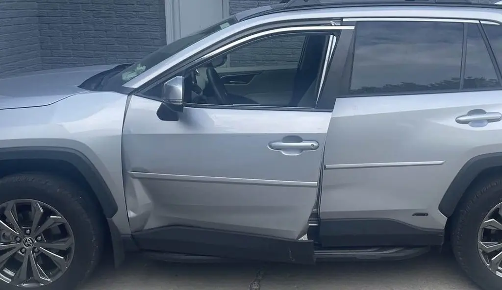 Toyota RAV4 with door damage, before repair