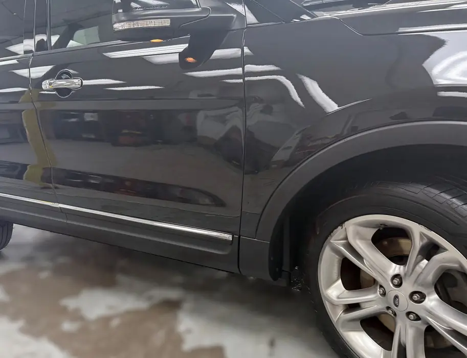 Ford Explorer rear door and quarter panel after dent repair and paint match