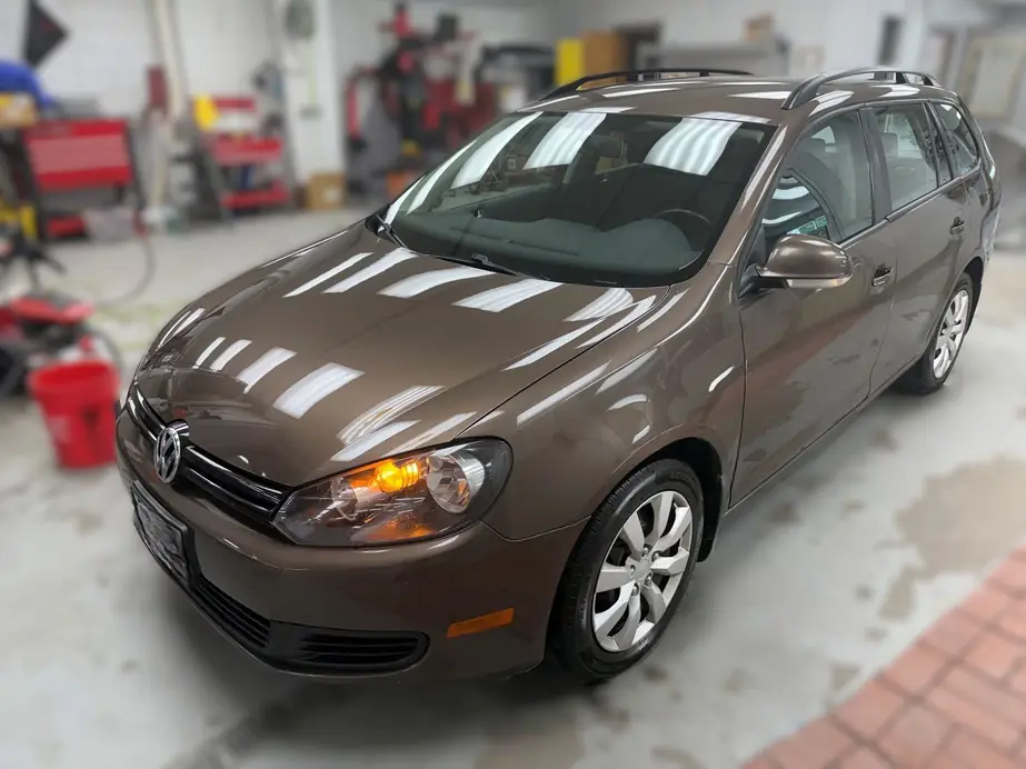The same Volkswagen Jetta wagon after collision repair, front end and windshield restored