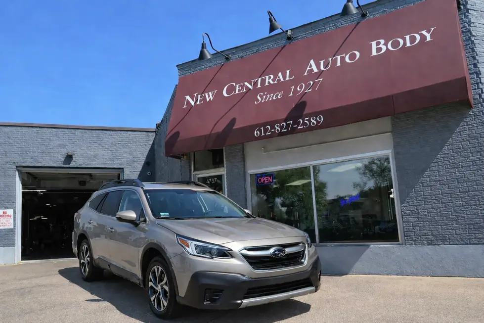 The New Central Auto Body awning reading Since 1927 above the shop's front window